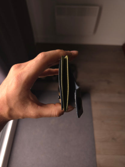 Le Patron wallet showing card slots and cash compartment. colors are navy & olive.